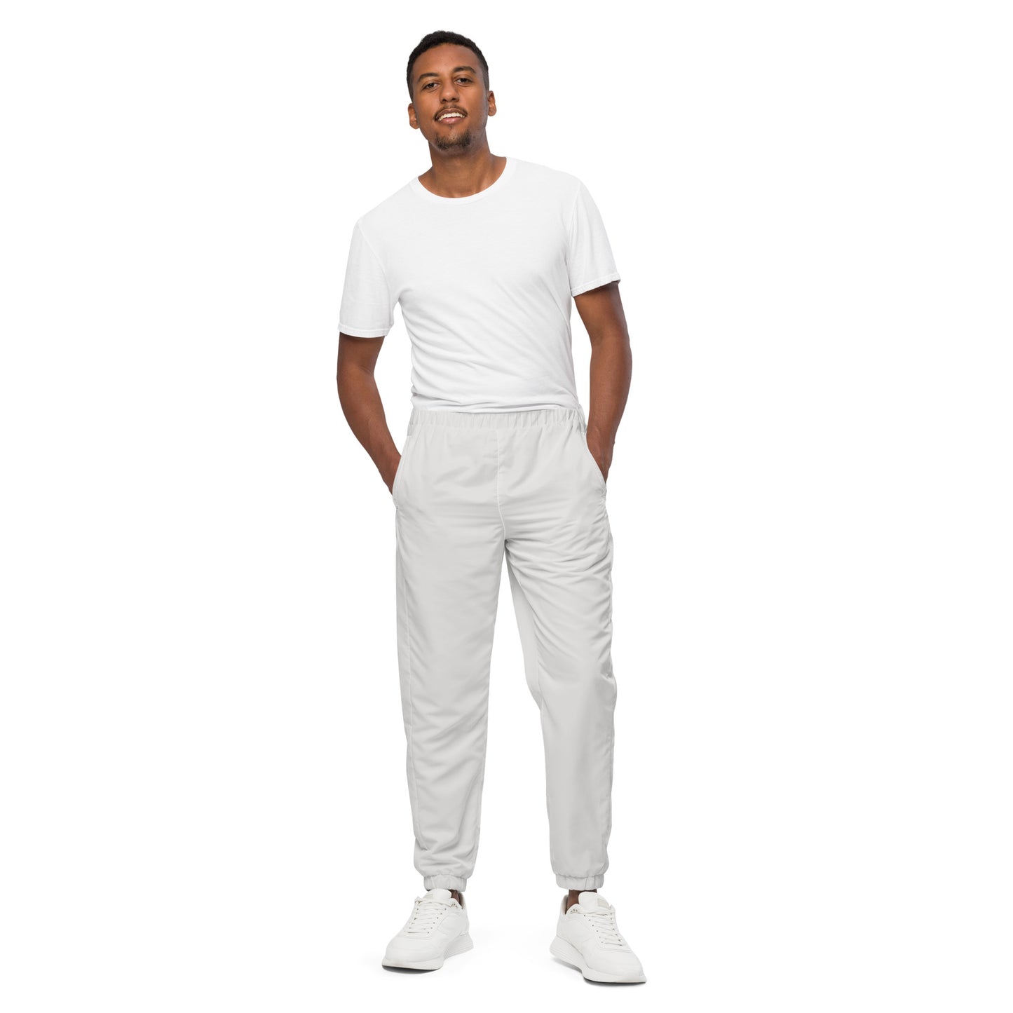 Unisex track pants Platinum worn by a model, featuring elastic cuffs and a lightweight, water-resistant design.